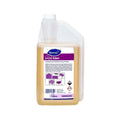 Envase de 1.89L y botella del sistema Accumix del desinfectante Suma Eden para frutas, verduras y superficies.